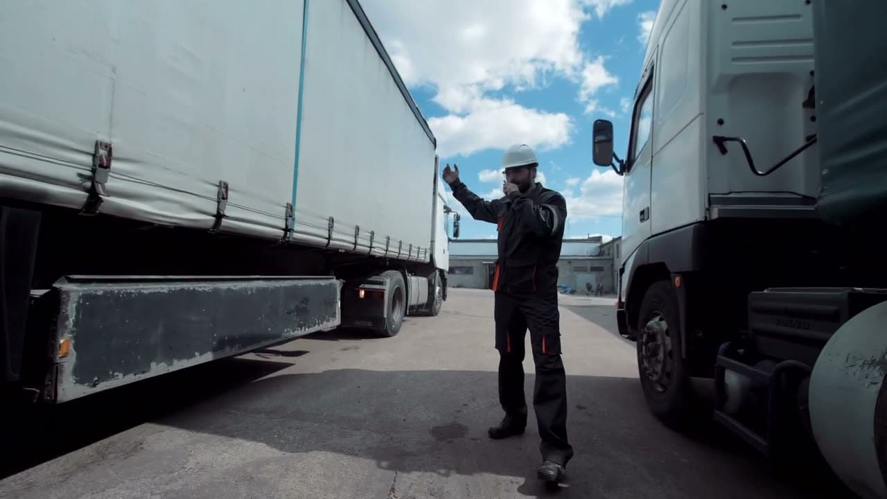 Coordinator directing a truck by radio